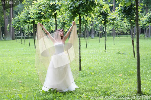 Image of girl stand in the summer park