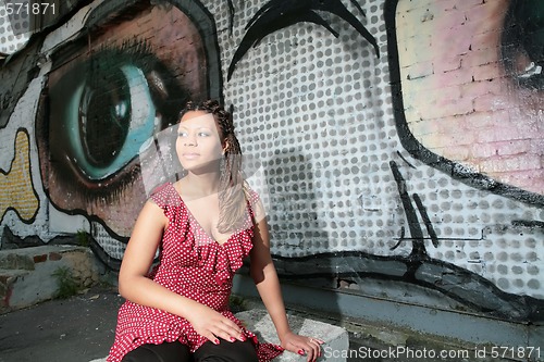 Image of beautiful girl in red polka dress