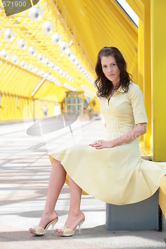 Image of young woman in yellow dress