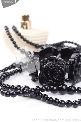 Image of black necklace, bracelet and parfume 