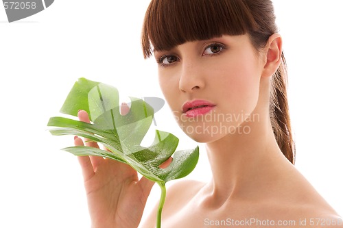 Image of woman with green leaf