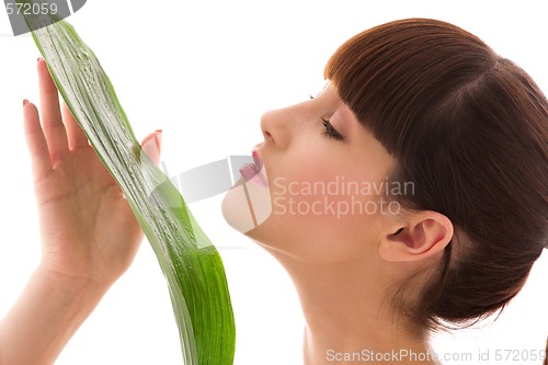 Image of woman with green leaf