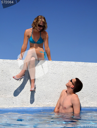 Image of Couple by the pool