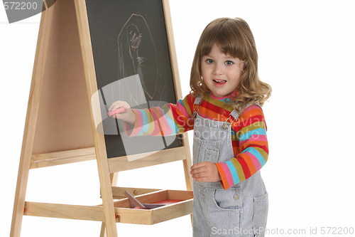 Image of beauty a little girl writing