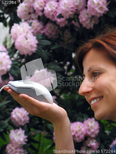 Image of Young girl holding computer mouse