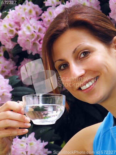 Image of Young girl drinking water