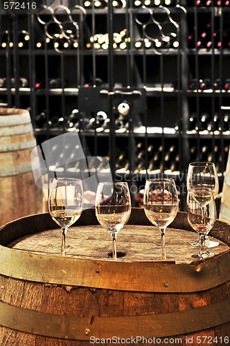 Image of Wine  glasses and barrels