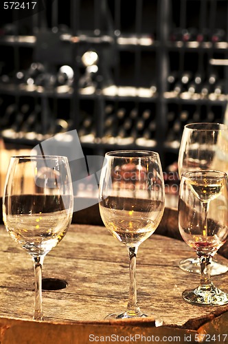 Image of Wine  glasses and barrels