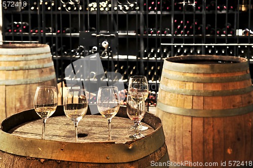 Image of Wine  glasses and barrels