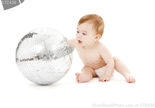 Image of adorable baby boy with big disco ball