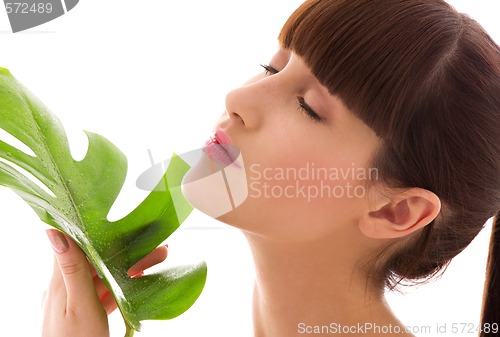 Image of woman with green leaf