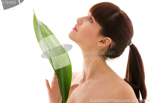 Image of woman with green leaf
