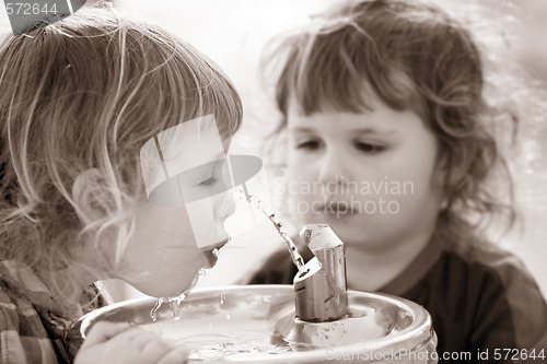 Image of Two boys by the drinking fountain