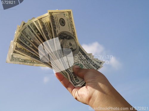 Image of holding dollars