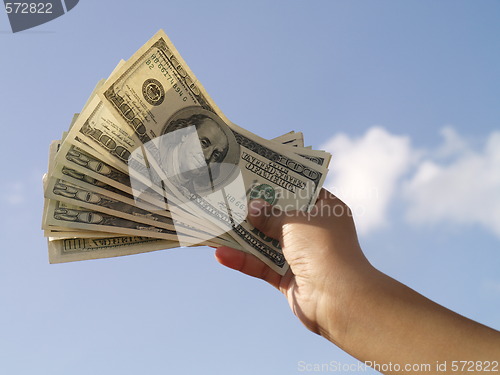 Image of holding dollars