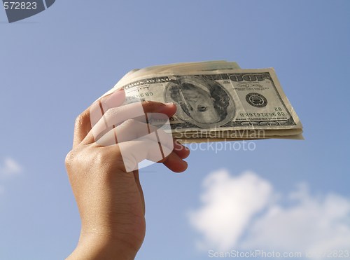 Image of holding dollar bills