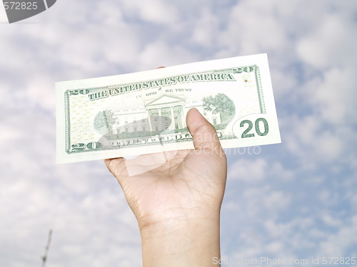 Image of holding 20 dollar