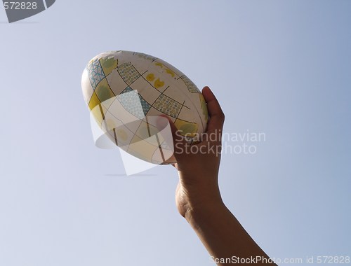Image of holding easter egg