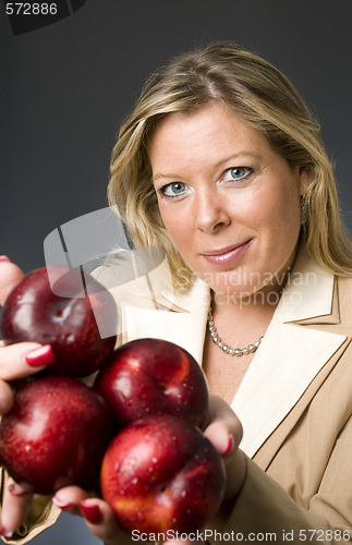 Image of attractive blond woman with plums fruit for healthy life