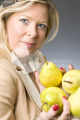 Image of attractive blond woman with pears fruit for healthy life