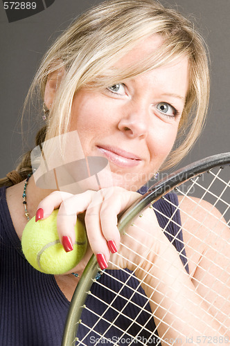 Image of happy smiling female tennis player with racquet and ball healthy
