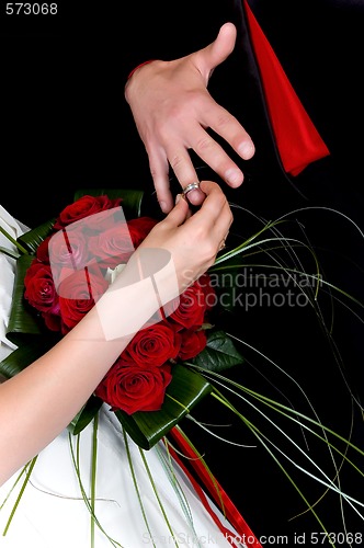 Image of Hands over wedding bouquet