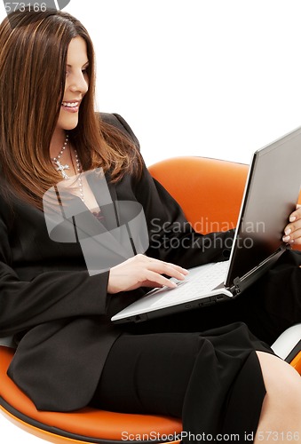 Image of businesswoman in chair with laptop