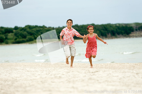 Image of kids running on the beach