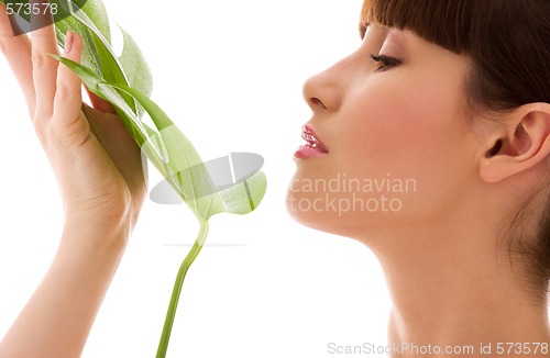 Image of woman with green leaf