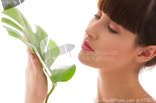 Image of woman with green leaf