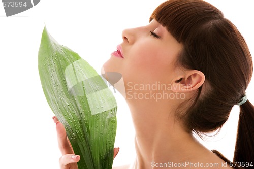 Image of woman with green leaf