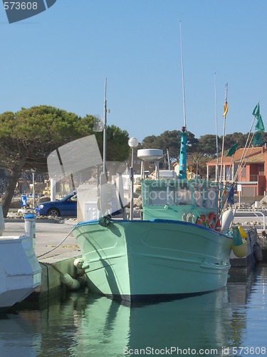 Image of green fisher boat