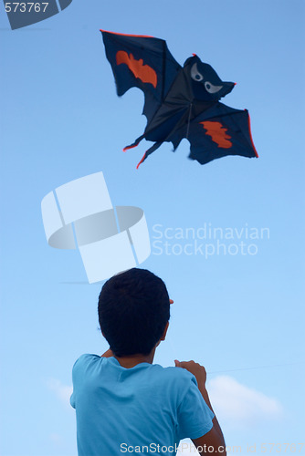 Image of Playing with a paper kite in the sky