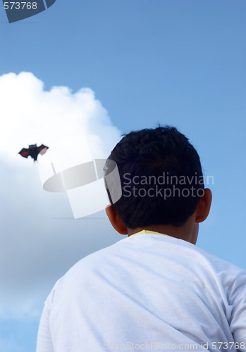 Image of Playing with a paper kite in the sky