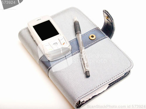 Image of Office objects - Pen diary and a cell phone