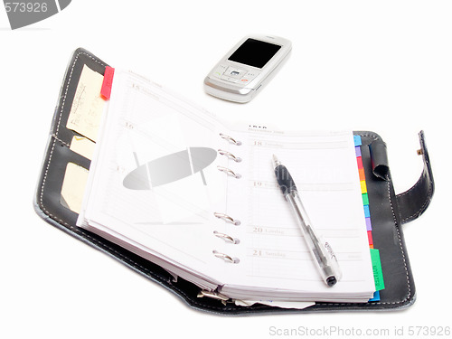 Image of Office objects - Pen diary and a cell phone