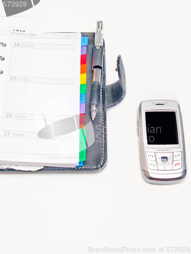 Image of Office objects - Pen diary and a cell phone