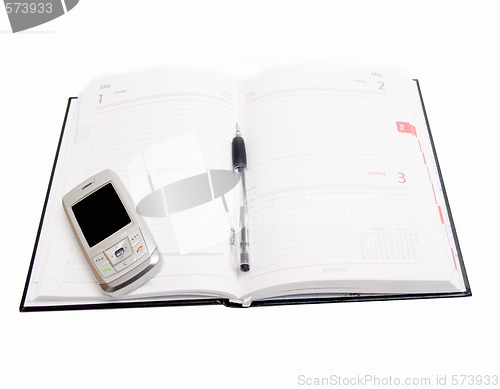 Image of Business Objects - Diary open with cellphone on  white
