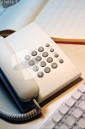 Image of office phone and keyboard