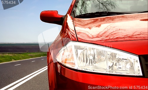 Image of Green Sport car on a highway