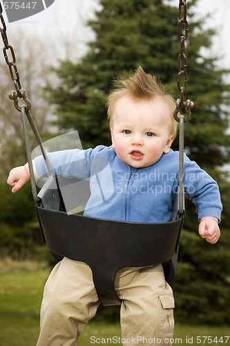 Image of Happy Boy on Swing