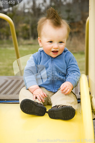 Image of Happy Boy on Slide