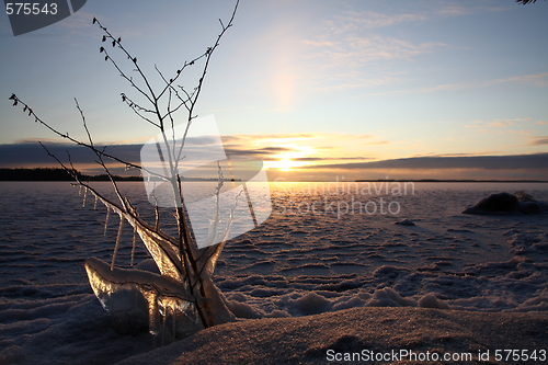 Image of Sunset over frozen lake