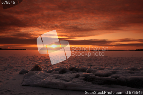 Image of Sunset over frozen lake