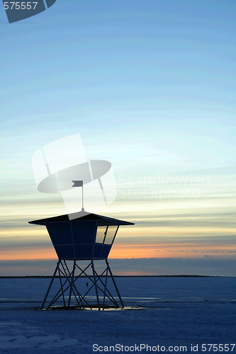 Image of Sunset over frozen lake