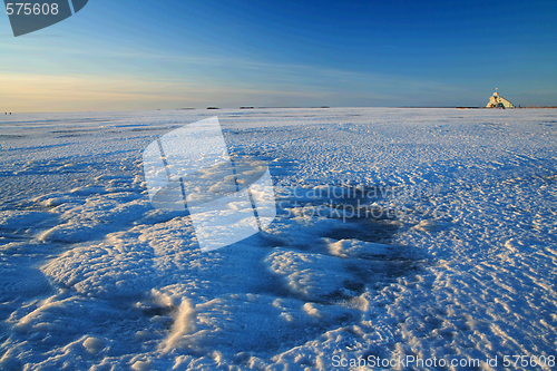 Image of Sunset over frozen lake