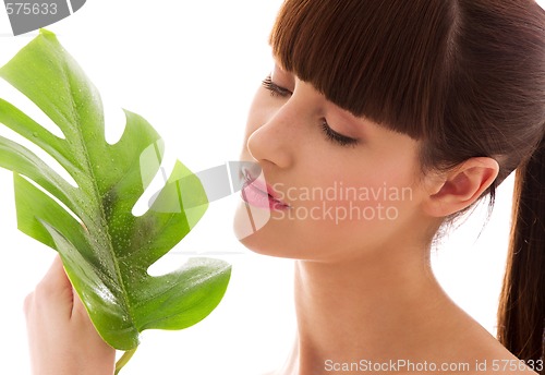 Image of woman with green leaf