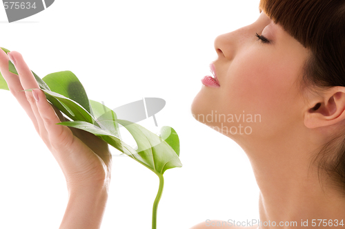 Image of woman with green leaf