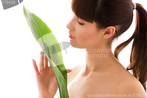 Image of woman with green leaf