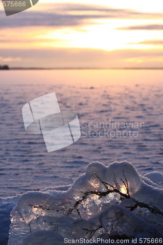 Image of Sunset over frozen lake